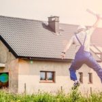 A happy contractor with a building permit in his hand jumping in the air, symbolizing the correct procedure for expanding your home in Clarksville TN.