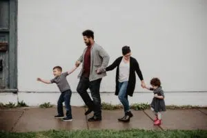 A family of four walking on a sidewalk in Clarksville TN