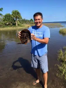 Clarksville TN Realtor Ron Dayley holding a horseshoe crab. Ron has been Rated #4 in the state of TN. Your Clarksville TN Realtor, Ron Dayley